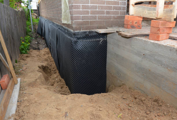 SJ Waterproofing Pros technician performing targeted Foundation Crack Repair assessment in Tallassee, TN